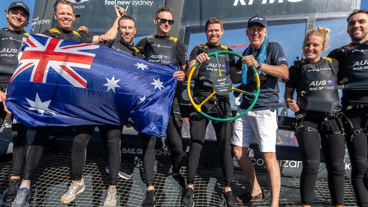 Australia SailGP Team celebrate their victory with the national flag.