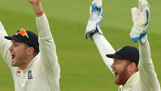 LONDON, ENGLAND - JULY 26: England wicketkeeper Jonny Bairstow (r) and Jason Roy celebrate after Stuart Broad had dismissed Kevin O' Brien during day three of the Specsavers Test Match between England and Ireland at Lord's Cricket Ground on July 26, 2019 in London, England. (Photo by Stu Forster/Getty Images)