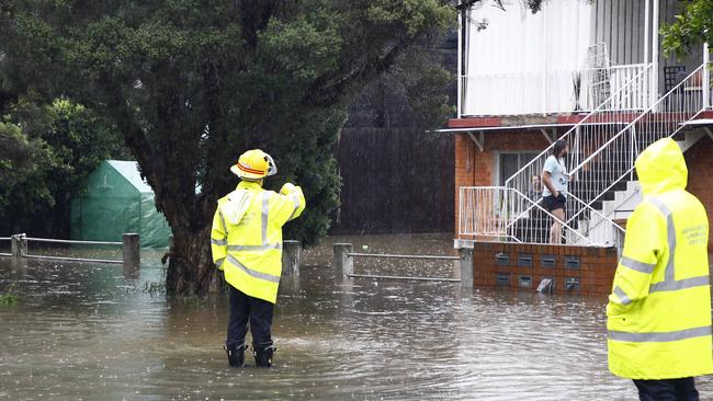 Emergency services at the scene of a flooded home. Picture: NCA NewsWire/Tertius Pickard