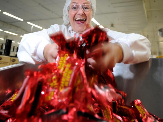 Rhonda MacDonald with Cherry Ripe bars being manufactured at the Cadbury plant at Ringwood. Picture: Andrew Henshaw