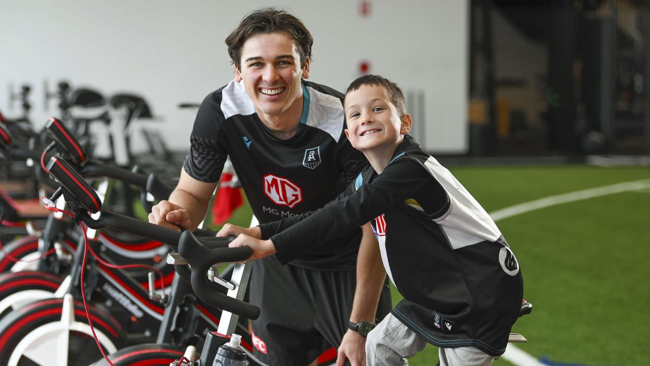 Xavier Pudovkin, 7, is a massive Port fan and is currently battling cancer and got to hang out with Connor Rozee at their indoor training centre. Picture Mark Brake