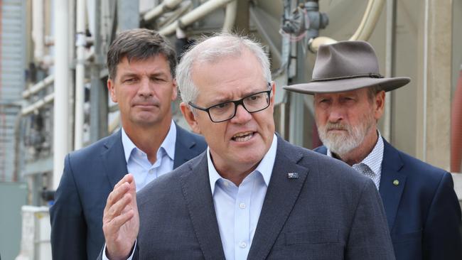 Scott Morrison with Energy Minister Angus Taylor, left, and MP Rowan Ramsey in Clare, South Australia, on Sunday. Picture: Dean Martin.