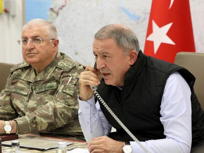 Turkey's Defence Minister Hulusi Akar (right). Picture: AP