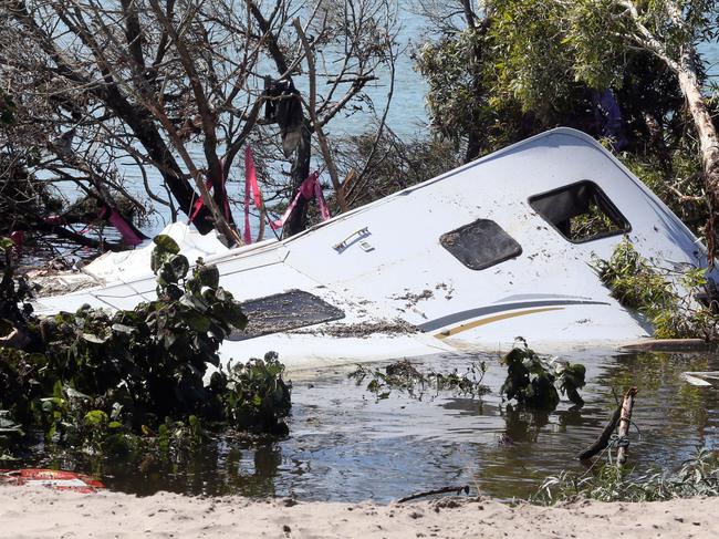 Sinkhole Inskip Point. Submerge caravan and four wheeled drive . and camper trailer. owners of van Jenny and Dida .pic Glenn Barnes