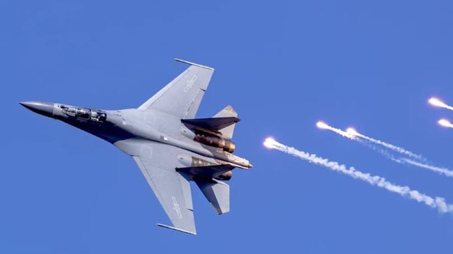 A Chinese J-16 jet fighter dumps flares. Picture: Supplied