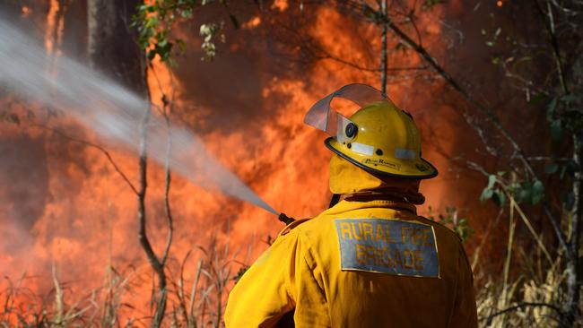 Glenwood Rural Fire Brigade officers try to control a bush Fire at Bauple that has burnt out huge tracks of land. Photo Craig Warhurst / The Gympie Times