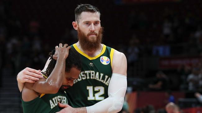 BEIJING, CHINA - SEPTEMBER 13:  Aron Baynes with Patty Mills of Australia reacts after lose the game against Spain during the semi-finals of 2019 FIBA World Cup match between Spain and Australia at Beijing Wukesong Sport Arena on September 13, 2019 in Beijing, China.  (Photo by Lintao Zhang/Getty Images)