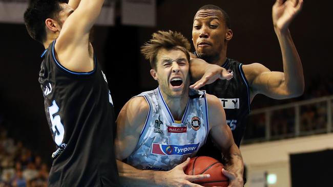 Adelaide’s Nathan Sobey cops some rough treatment from the Breakers’ Akil Mitchell. Sobey remains a threat for New Zealand, Mitchell an inspiration. Picture: Fiona Goodall (Getty Images)