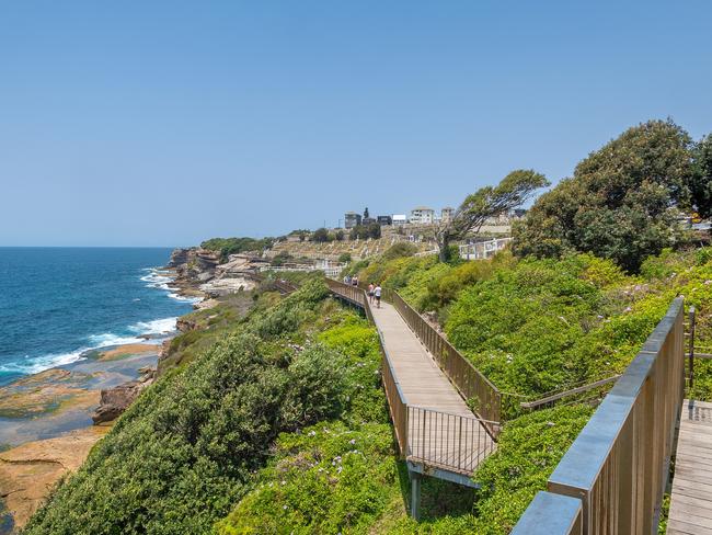 Sydney, Australia - December 28th, 2019: People walking to Waverley Cemetery along the Bondi to Coogee coastal walk. A cliff top coastal walk featuring stunning views, beaches, cliffs, and rock pools.