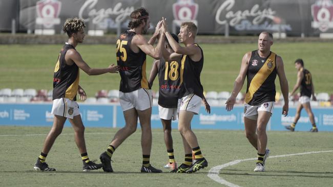 North Cairns Tigers player-coach Jason Tom celebrates kicking one of his four goals in their clash against Manunda Hawks at Cazalys Stadium. Picture: Nuno Avendano