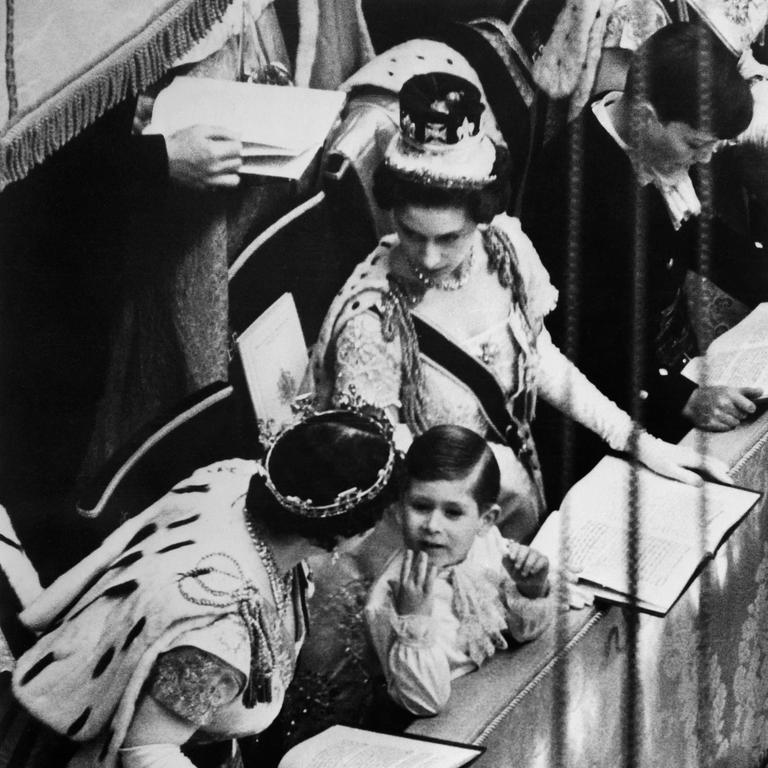 Charles is seen with his mother, the Queen, during her Coronation (Photo by AFP)