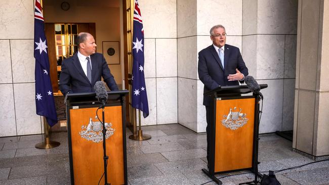 Prime Minister Scott Morrison and Treasurer Josh Frydenberg announcing the economic package on Sunday. Picture: AFP