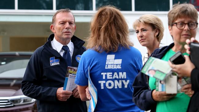 Former prime minister Tony Abbott and senator Michaelia Cash campaign outside a Warringah pre-polling centre yesterday. Picture: Hollie Adams