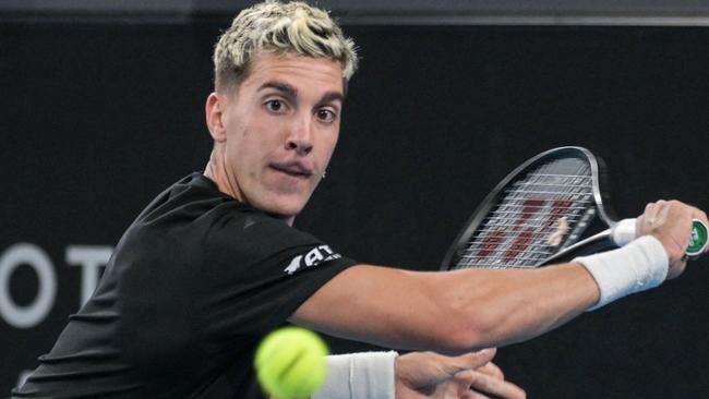 Australia's Thanasi Kokkinakis hits a return against Italy's Jannik Sinner during their men's singles match at the Adelaide International tennis tournament in Adelaide on January 5, 2023. (Photo by Brenton EDWARDS / AFP) / – IMAGE RESTRICTED TO EDITORIAL USE – STRICTLY NO COMMERCIAL USE-