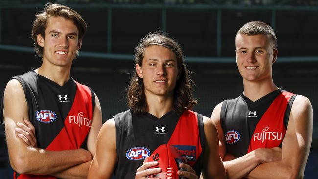 Zach Reid, draft selection #10 (L), Archie Perkins, draft selection #9 and Nik Cox, draft selection #8 (R). (Photo by Dylan Burns/AFL Photos via Getty Images)