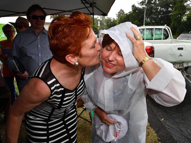 One Nation leader Senator Pauline Hanson (left) and ALP member for Bundamba, Jo-Ann Miller (right) are seen together in the suburb of Bundamba in Ipswich during the Queensland Election campaign on Tuesday, November 21, 2017. Senator Hanson is campaigning in the electorate of Bundamba currently held by the ALP's Jo-Ann Miller. (AAP Image/Darren England) NO ARCHIVING