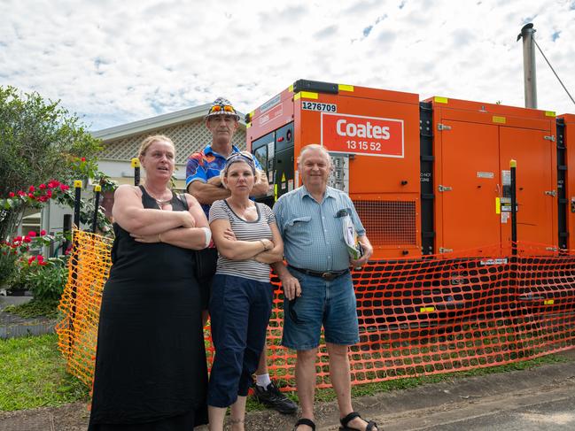 Kerri Mason, Kerrie Dowd, Pat Wilcocks and George Pawlowski with one of the eight generators that have been supplying power to the flood damaged community. Picture Emily Barker.