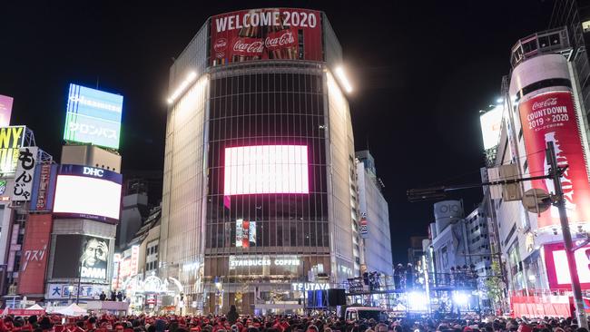 People gather during the You Make Shibuya Countdown 2019-2020 event at Shibuya Crossing on December 31, 2019 in Tokyo, Japan. The countdown event was held at the world's busiest crossing to celebrate the new year. Picture: Tomohiro Ohsumi/Getty