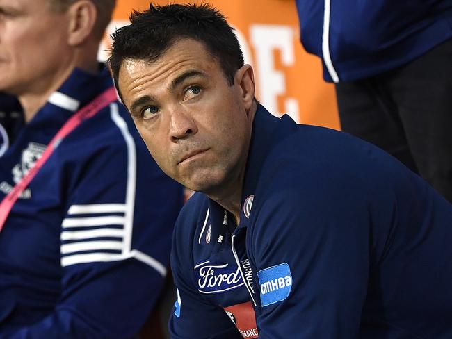 MELBOURNE, AUSTRALIA - SEPTEMBER 20: Cats head coach Chris Scott sits on the bench before the start of the AFL Preliminary Final match between the Richmond Tigers and the Geelong Cats at Melbourne Cricket Ground on September 20, 2019 in Melbourne, Australia. (Photo by Quinn Rooney/Getty Images)