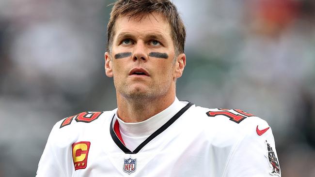 EAST RUTHERFORD, NEW JERSEY - JANUARY 02: Tom Brady #12 of the Tampa Bay Buccaneers looks on prior to the game against the New York Jets at MetLife Stadium on January 02, 2022 in East Rutherford, New Jersey.   Elsa/Getty Images/AFP == FOR NEWSPAPERS, INTERNET, TELCOS & TELEVISION USE ONLY ==