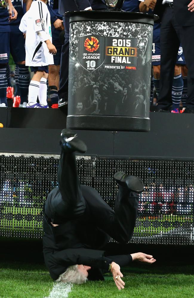 Impact ... 84-year-old FFA chairman Frank Lowy returned to the stage and walked from the field unassested after this nasty fall.  Pictures: Getty