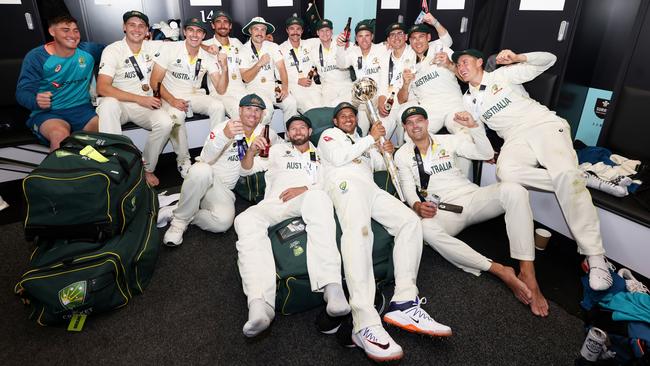 The Australian team celebrates with the World Test Championship mace in the changing room at The Oval in London on Sunday. Picture: Getty Images