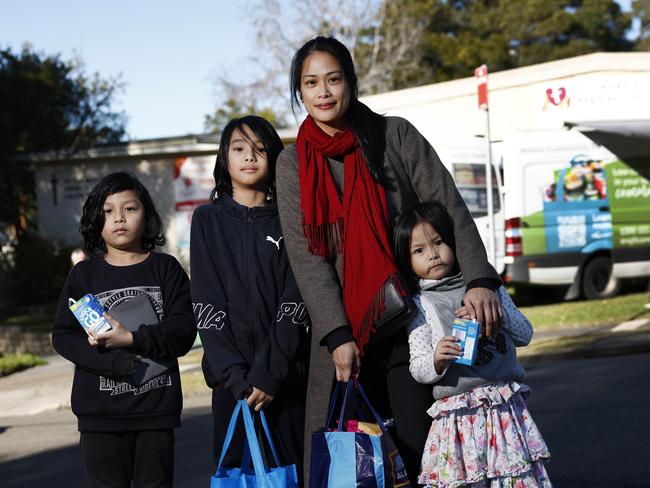 DAILY TELEGRAPH 17TH JULY 2024Pictured at St Clement's Anglican Church at Lalor Park in Sydney is single mother Peach Ross with her kids Blade (7) Blaze (10) and Bailey (6) who have recently started using the subsidised food van service provided by the Anglican Church to help save money.Picture: Richard Dobson