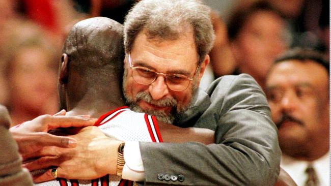 Chicago Bulls' coach Phil Jackson hugs Michael Jordan after winning their fourth NBA Championship in 1996. Picture: AP