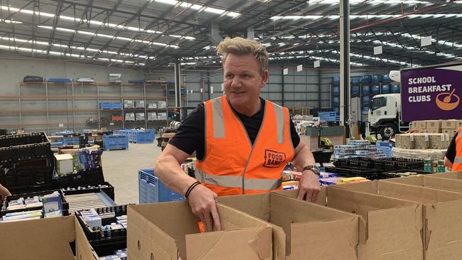 Celebrity chef Gordon Ramsey packing food hampers for bushfire victims.