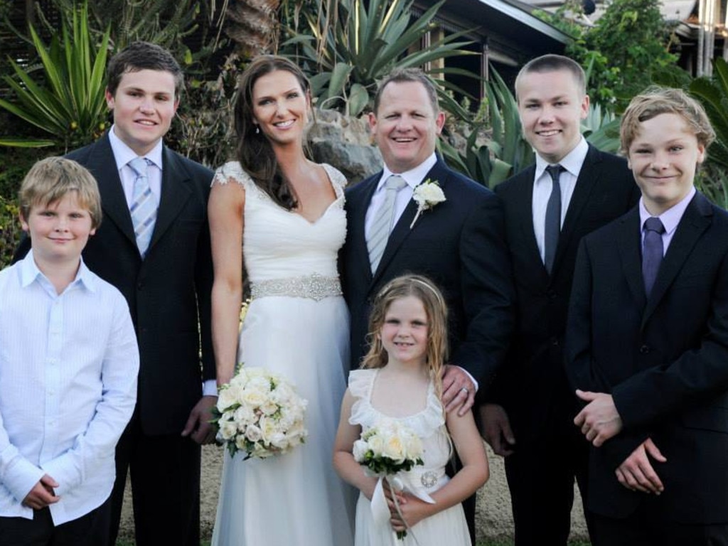 Narelle and Kevin Walters on their wedding day, with their five children.