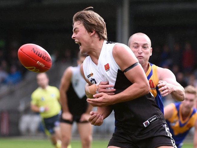 Riley Polkinghorne gets out a handball for North Ballarat.