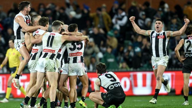 Zak Butters looks on as Collingwood players celebrate on the final siren. Picture: Getty Images