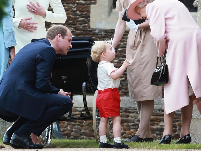Prince George of Cambridge talks to Queen Elizabeth II outside the Church of St Mary Magdalene on the Sandringham Estate for the Christening of Princess Charlotte of Cambridge on July 5, 2015 in King’s Lynn, England. Picture: Getty
