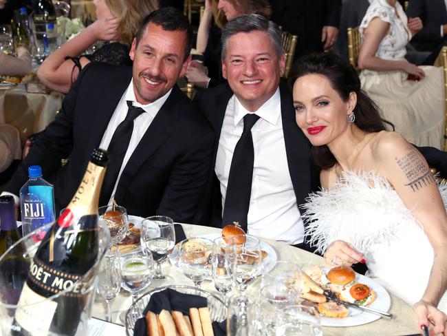 Adam Sandler, Ted Sarandos and Angelina Jolie attend the 23rd Annual Critics’ Choice Awards on January 11, 2018 in Santa Monica, California. Picture: Getty