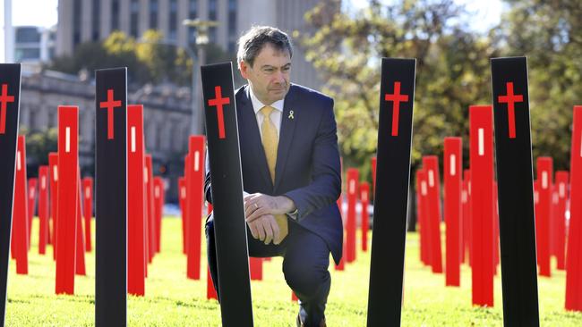 RAA spokesman Charles Mountain with hundreds of roadside markers in the heart of Adelaide to represent all the people who lost their lives or were seriously injured in crashes across SA. Picture: AAP / Dean Martin