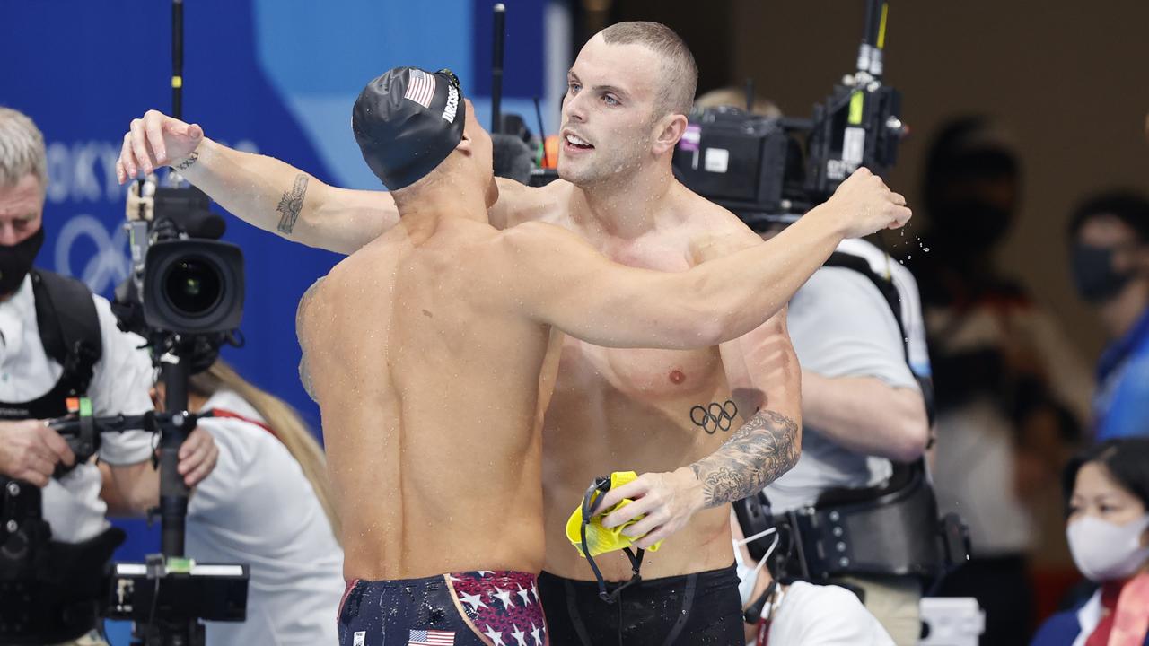 Australia’s Kyle Chalmers embraces Caeleb Dressel after the 100m freestyle final in Tokyo. Picture: Alex Coppel.