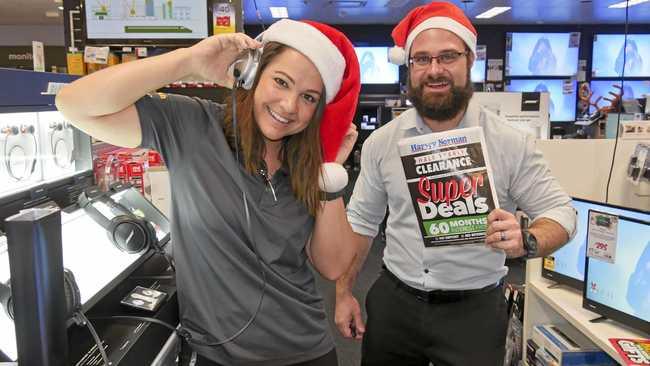 SUPER DEALS: Hervey Bay Harvey Norman electronics specialist Sam Shorten with electronics proprietor James Blum getting ready for boxing day sales. Picture: Jessica Lamb