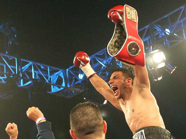 Billy Dib celebrates a world title victory.