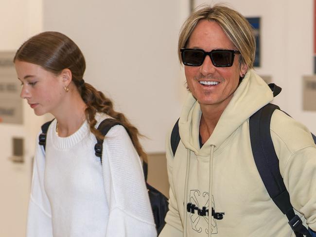 Flying in for Fathers Day! Keith Urban lands at Sydney Airport with his youngest daughter Faith (13) ahead of Father's Day. Picture: MEDIA-MODE.COM