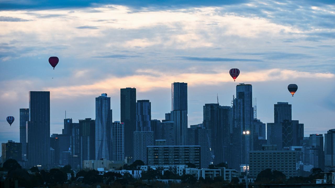 Hot air balloons soar over the Melbourne skyline ahead of a track work session at Flemington Racecourse in Melbourne. Picture: Vince Caligiuri/Getty Images