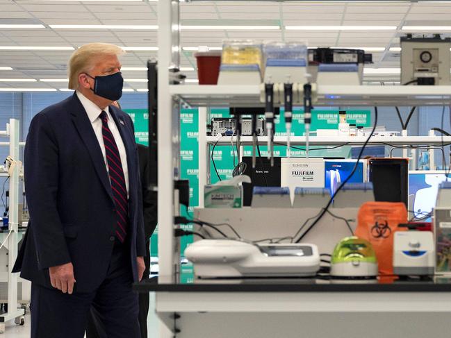 US President Donald Trump visits a lab where they are making components for a potential vaccine in North Carolina. Picture: AFP