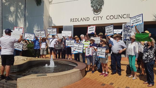 Supporters of community group Redlands2030 rally outside Redland City Council chambers urging Council to reveal more details about a large-scale proposed development at Toondah Harbour. Picture: Chris Walker.