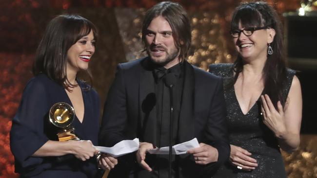 Rashida Jones, left, Alan Hicks and Paula DuPre Pesmen accept the award for best music film for Quincy. Picture: AP