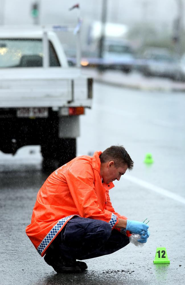 Police at the scene of the shooting on the Gold Coast Highway at Burleigh Heads.