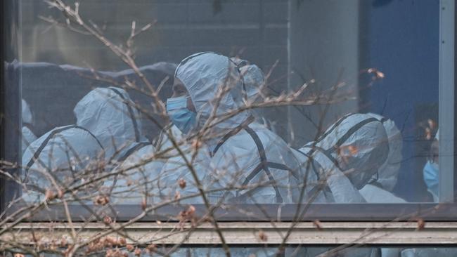 Members of the WHO team investigating the origins of the Covid-19 during their visit to the Hubei Center for animal disease control and prevention in Wuhan. Picture: AFP