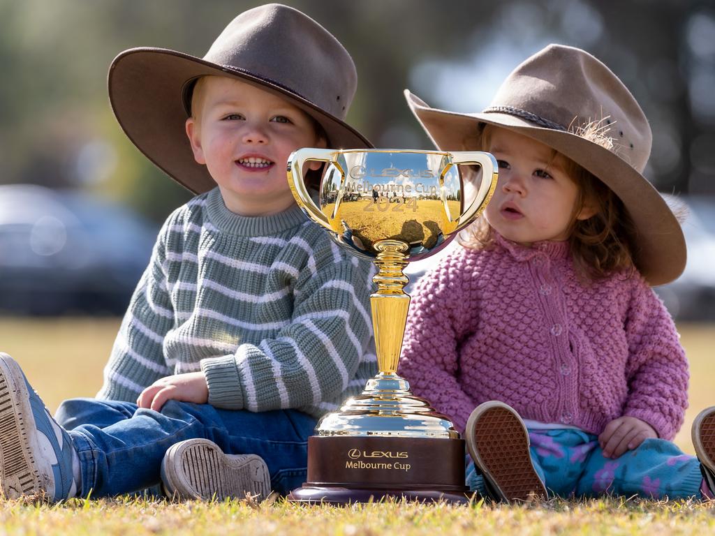 Wilbur, 3, and Polly Payne, 18 months Payne from Tullibigeal with the trophy in Barellan, NSW. Picture: Jay Town