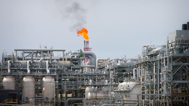 A flame blazes on top of flare stacks at Queensland’s Curtis Liquefied Natural Gas site. Picture: Getty Images