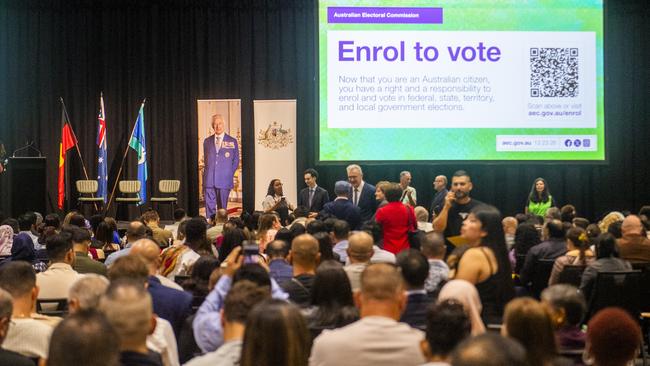 New citizens at a large ceremony at Sydney Olympic Park on Friday where a large screen organised by the Department of Home Affairs encouraged them to enrol to vote at the upcoming election. Picture: NewsWire / Jeremy Piper