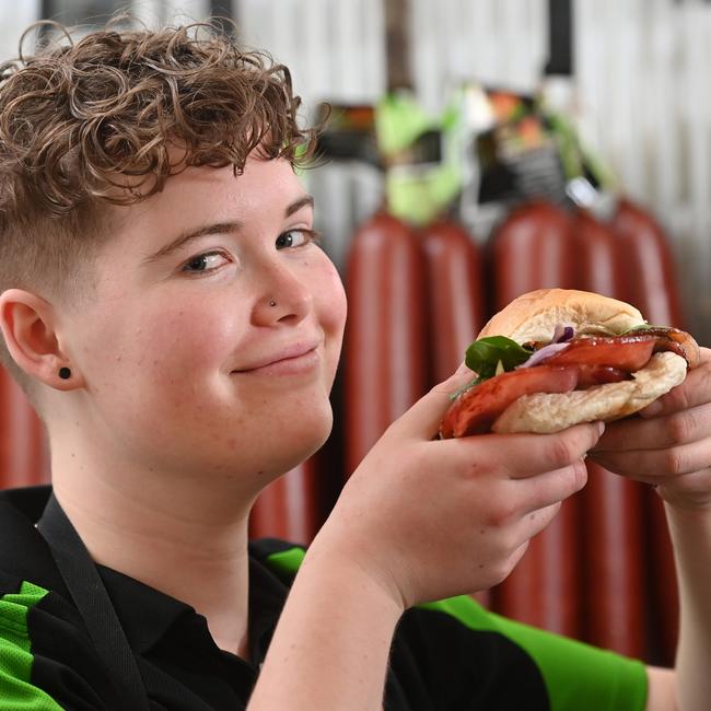 Apprentice Butcher Brianna Kirby enjoys a sandwich featuring the nation’s best bacon. Picture: Keryn Stevens