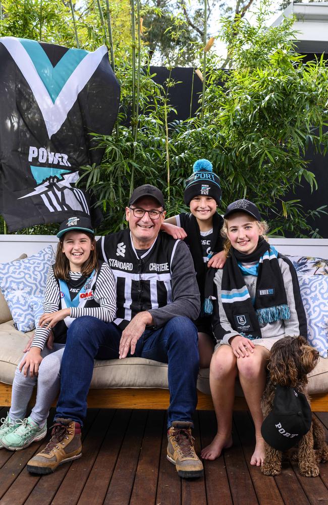 Port Adelaide president David Koch with grandchildren Lila, 8, Oscar, 11, and Matilda, 13, and their Power gear. Picture: Darren Leigh Roberts.